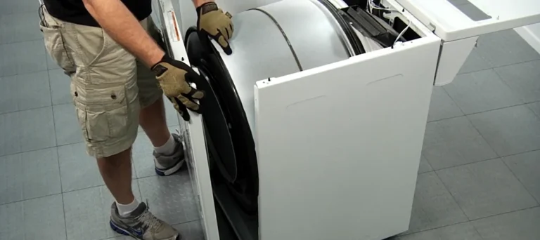 Technician Fixing Dryer