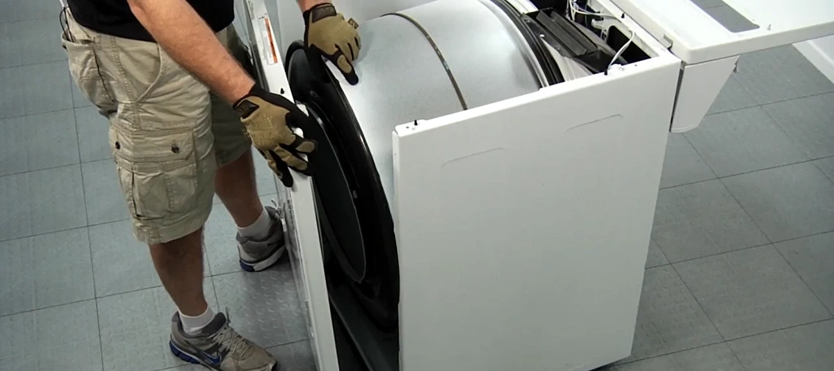 Technician Fixing Dryer